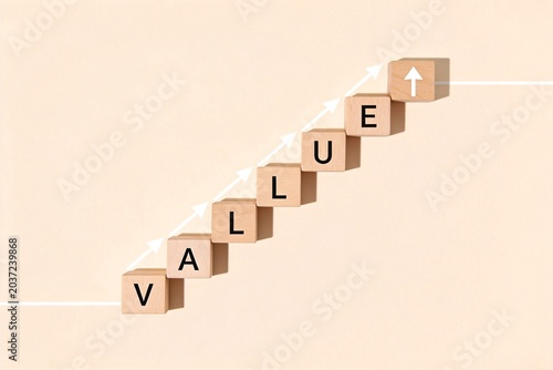 Wooden blocks spelling value with upward arrow