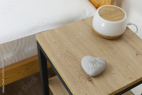Heart-shaped, gray stone with 