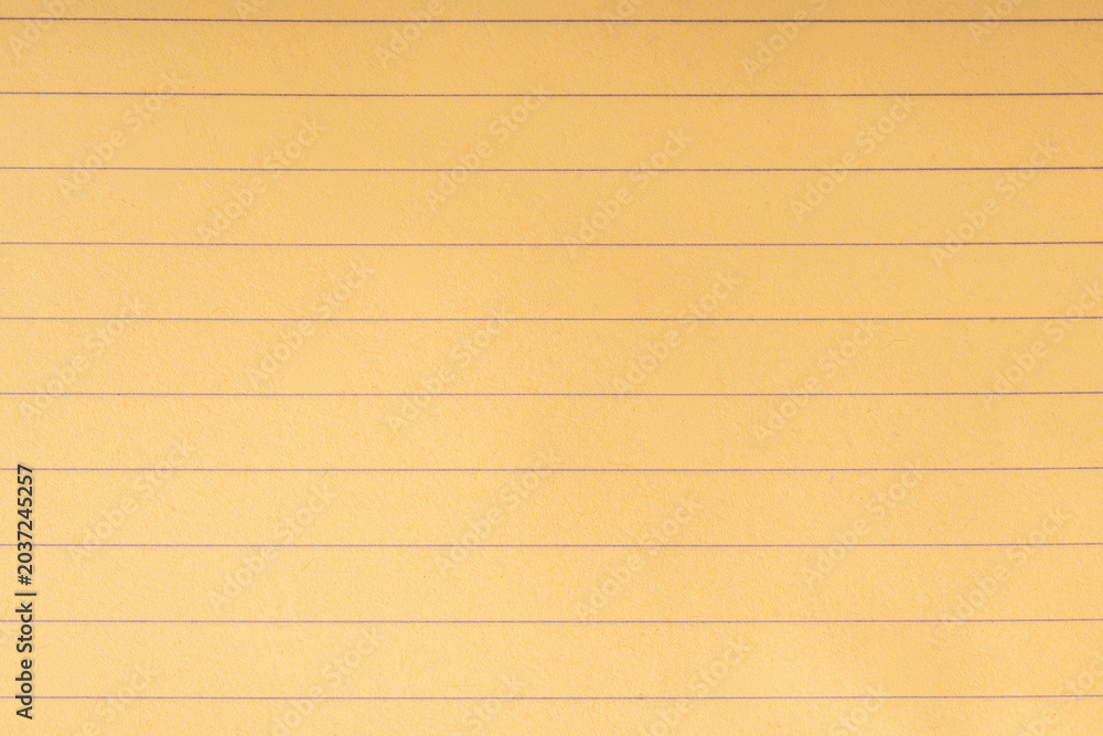 Obraz premium yellow lined notebook paper background