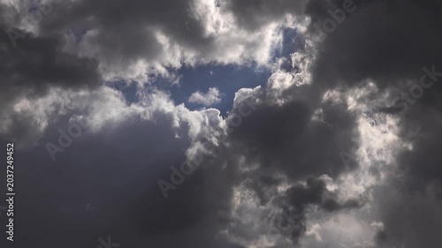 Small rain clouds forming into storm dark clouds.
