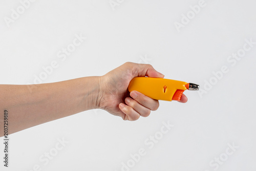 Принти на полотні Yellow gas lighter gun for gas-stove and hand isolated on white background