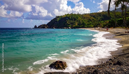 Serene tropical beach with turquoise water.