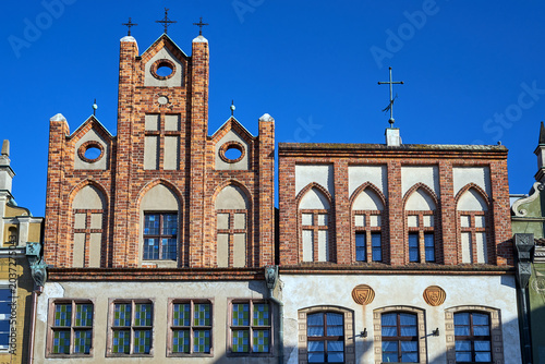 Bild auf Leinwand fragment of the facade of historic tenement houses in Poznan
