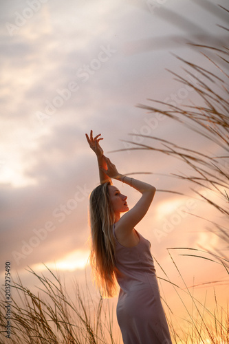 Woman in golden sunset light with elegant silhouette, feminine strength, natural beauty aesthetic, outdoor nature portrait and self confidence concept