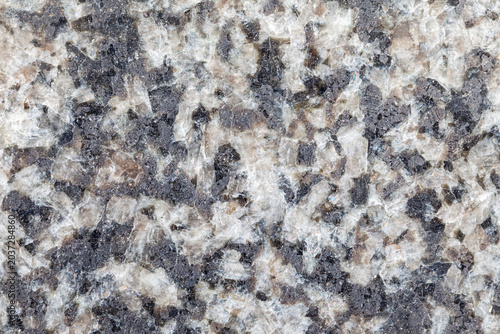 Polished gray and white granite stone cut background material texture