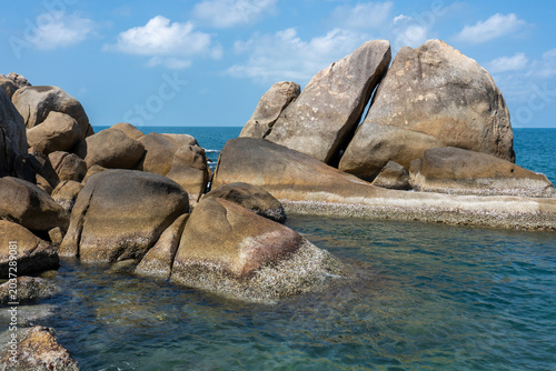 Beautiful tropical island with giant granite rock formations on the beach, crystal clear turquoise water