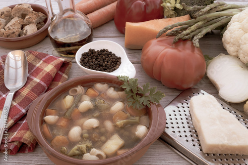 Fotografija Closeup view of a wooden table with a fresh, ready-to-eat homemade vegetable soup