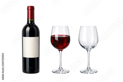 Wine bottle with two glasses against plain backdrop.