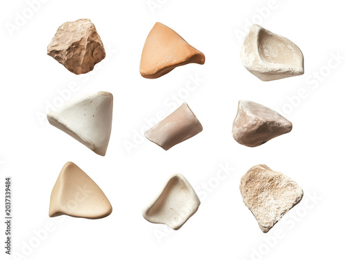 Ancient pottery shard fragments arranged in a grid showcasing archaeological artifacts with texture and history