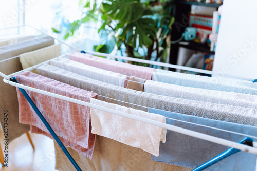 Fotografie clothes are dried on a clothes dryer indoors