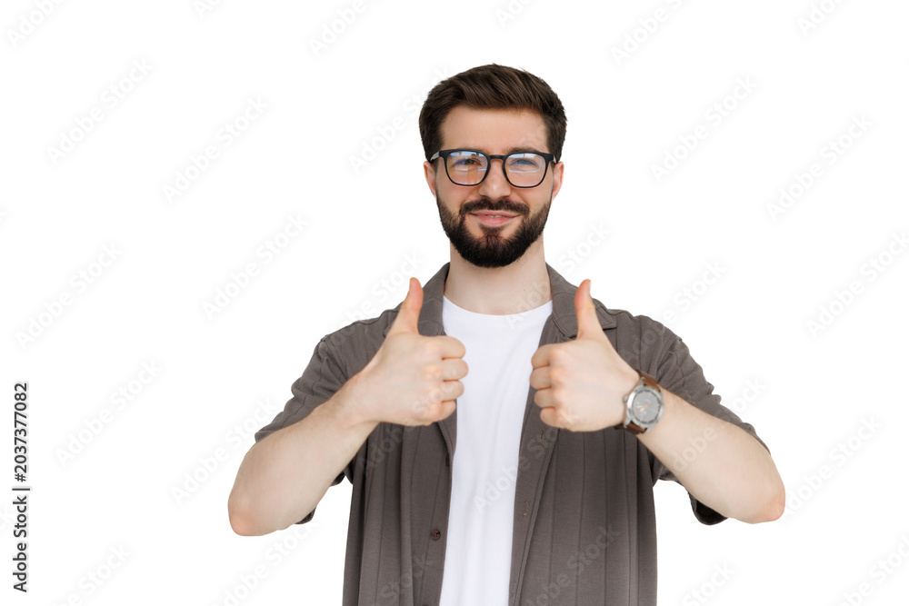 Behang Young man with thumbs up isolated on white background