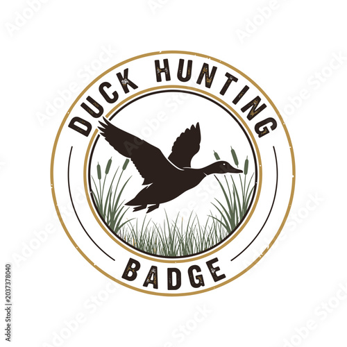 Duck Hunting Badge Emblem Silhouette Flying Bird Reeds.