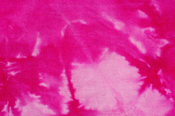 Macro view of textured pink tie dye fabric