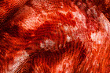 Macro view of red tie dye fabric texture