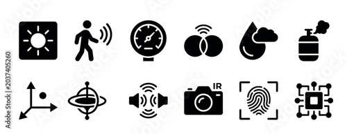 Collection of black solid sensor icons for smart technology, featuring symbols for light, motion, pressure, proximity, gas, gyroscope, sound, infrared, fingerprint, and a microchip