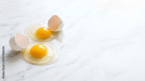 Fresh Cracked Eggs on Marble Background