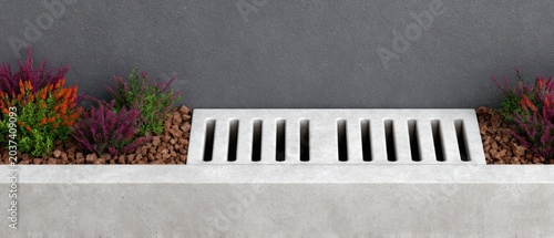 Modern Concrete Drainage Grate With Garden Landscaping for Outdoor Water Flow Management and Contemporary Urban Home Infrastructure Design