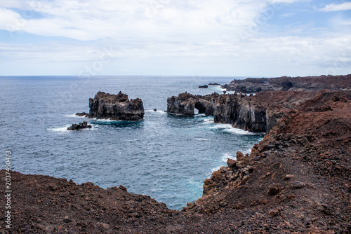 Photos Volcanic rock formation near arco de la Tosca and natural stone arches on the ru