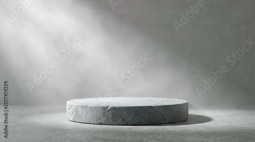 Fotografi Empty stone podium standing gracefully against dark concrete wall illuminated by