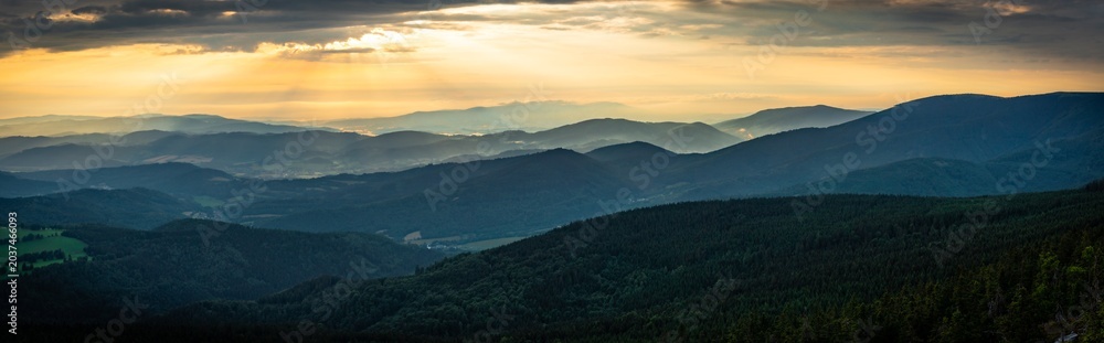 Fototapeta premium Panoramic view at golden sunlight over landscape around Jeseniky mountains