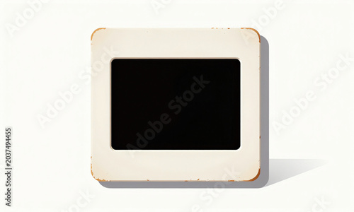 weathered vintage photographic slide frame sits pristine white backdrop illuminated soft diffused light capturing