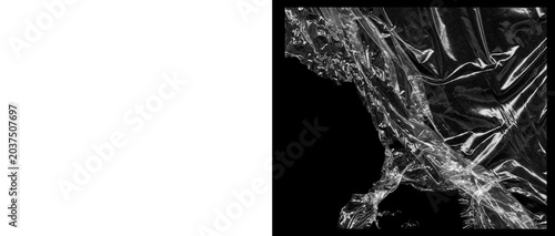 Tableau sur toile Crumpled plastic wrap texture on black background, wrinkled transparent cellopha
