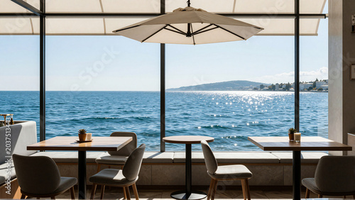 Minimalist cafe interior overlooking the sparkling blue ocean on a sunny day