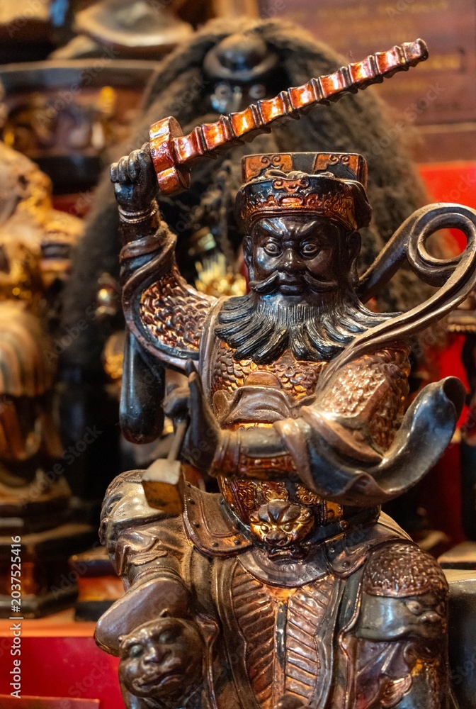 Fototapeta premium A close-up of a wooden statue of the Chinese traditional deity which master ghosts