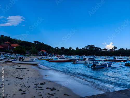 Photos Traditional jukung outriggers and fast boats anchored near the shore of Padangba