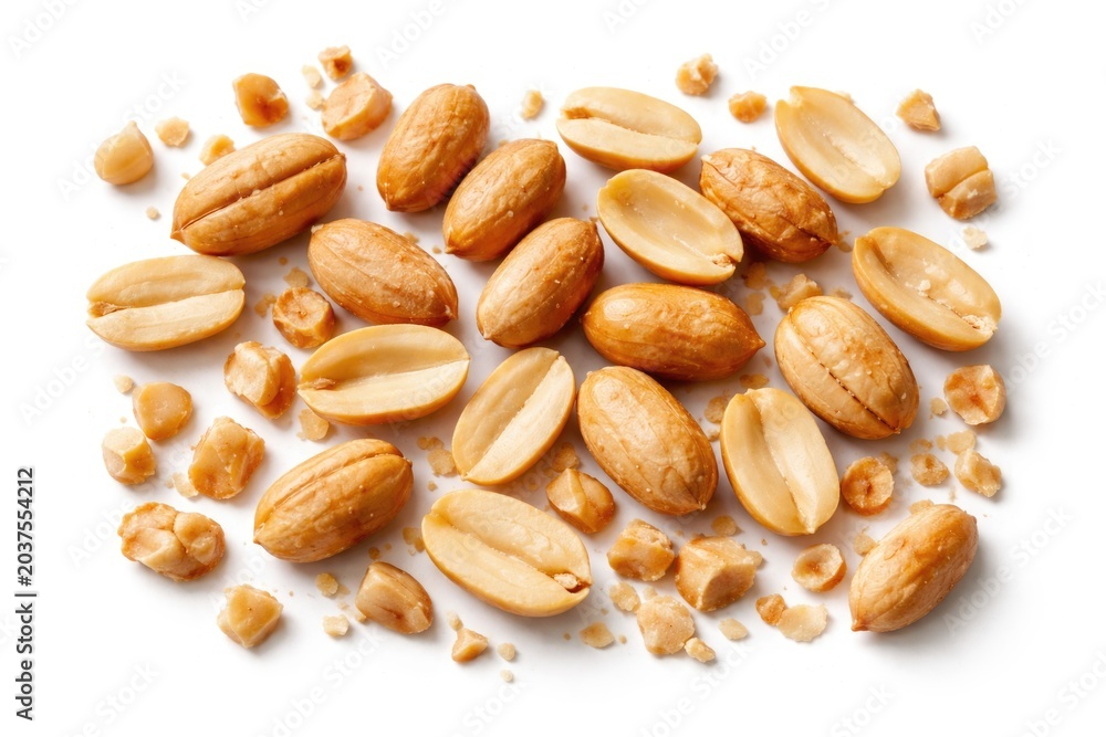 Fototapeta premium Roasted peanut fragments and whole nuts arranged on a pristine white background for snack visuals
