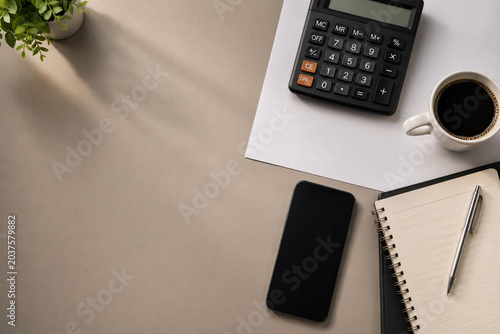 Home Budget Planning Workspace with Calculator Smartphone and Notebook