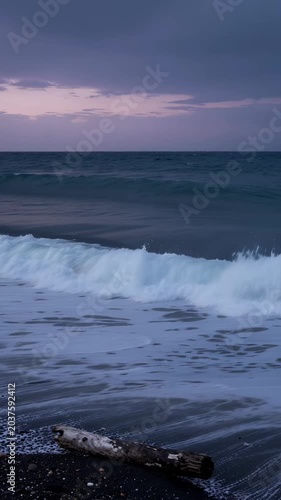 Serene Beach Scene at Dusk with Gentle Waves and Clouds in the Sky Reflecting Coastal Tranquility