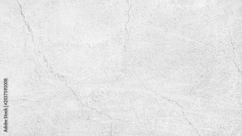 Fotografie White cracked concrete wall texture background with rough plaster surface