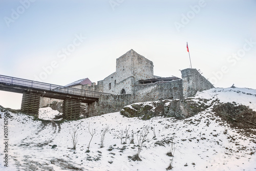 old Polish castle on a snowy hill. Winter landscape with a castle  in Dobczyce, Poland