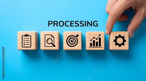Business process icons on wooden blocks with processing text