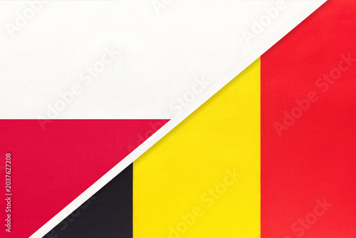 Poland and Belgium national flags on fabric background, international partnership and cooperation between two countries