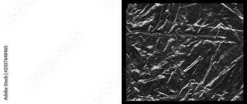 Crumpled plastic wrap texture, a transparent wrinkled film overlay for abstract backgrounds. Shiny, reflective, and distressed surface for modern design elements.