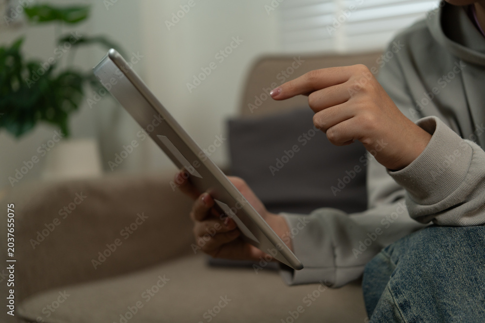 Fototapeta premium Cheerful woman use smartphone, enjoy personal chat exchanges messages through mobile application, learn new AI platform for business or fun, distracted from workflow on laptop in workplace.