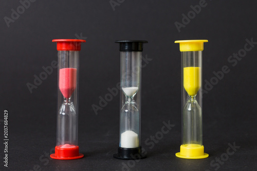hourglass on the table, sand clock as time passing concept for business deadline, copy space