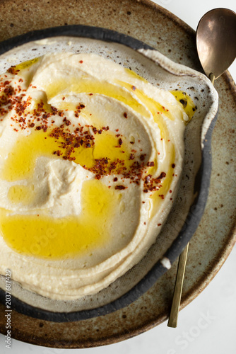 Homemade hummus with olive oil and Aleppo pepper