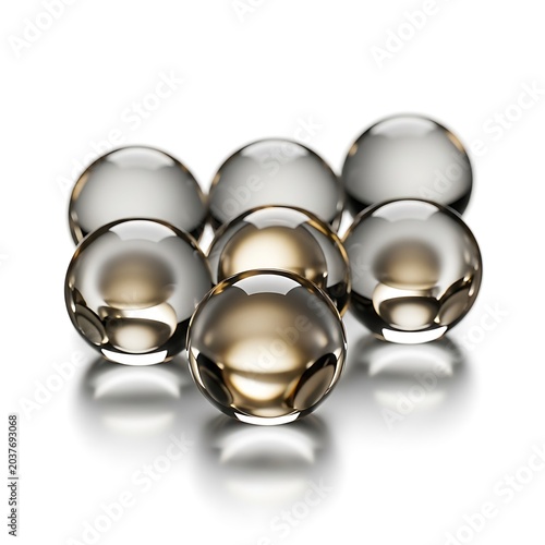 Shiny metallic spheres on reflective surface.