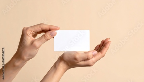Hand Holding Blank Card with Chip on Light Cream Background with Modern Banking Card Mockup and Financial Payment Concept Presentation
