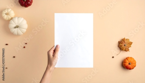 Hand Holding Blank Flyer on Light Cream Background with Minimal Marketing Template and Promotional Design Presentation Concept