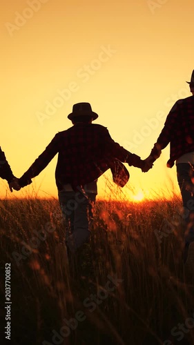 Large group people, fun children together papa mama. Family. Children, parents running in summer nature park, holding hands, expressing happiness. Mom dad, children joyfully running across sunny lawn.