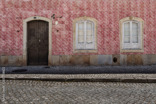 Traditional red tile facade of building in central Silves