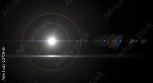 Dramatic lens flare with bright light streaks on a black background