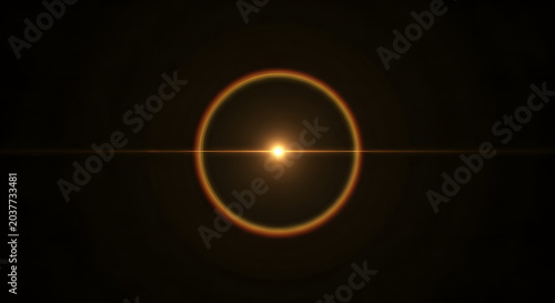 Golden lens flare with circular halo and bright light on black background