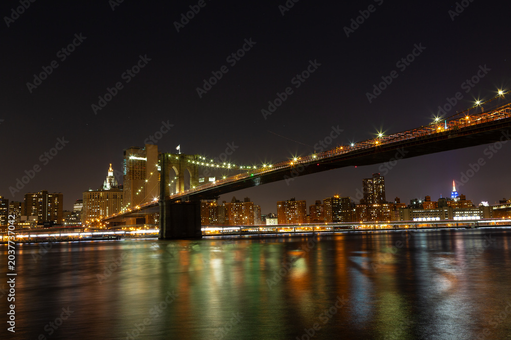 Fototapeta premium Brooklyn Bridge Illuminated at Night in New York