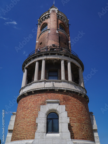 old tower symbol of the city made of red facade brick photographed on a sunny day
