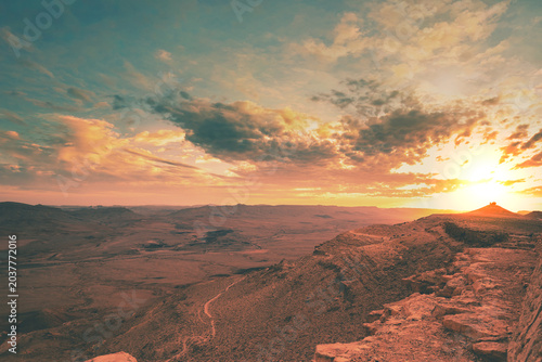 Beautiful dramatic sunset over the desert. Nature landscape. Makhtesh Ramon Crater, Israel
